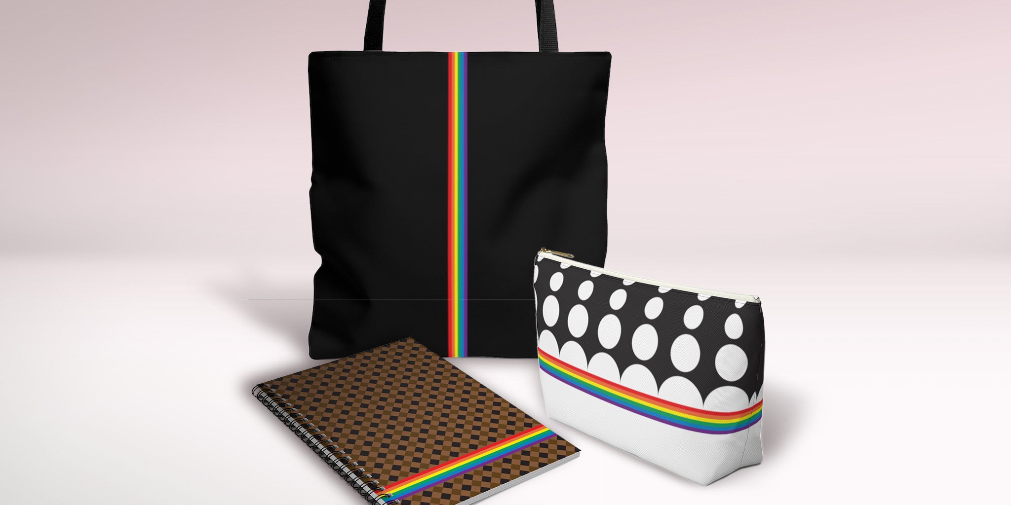 Tote bag, zippered pouch, and spiral notebook, all with colorful rainbow designs by My Friend Ren