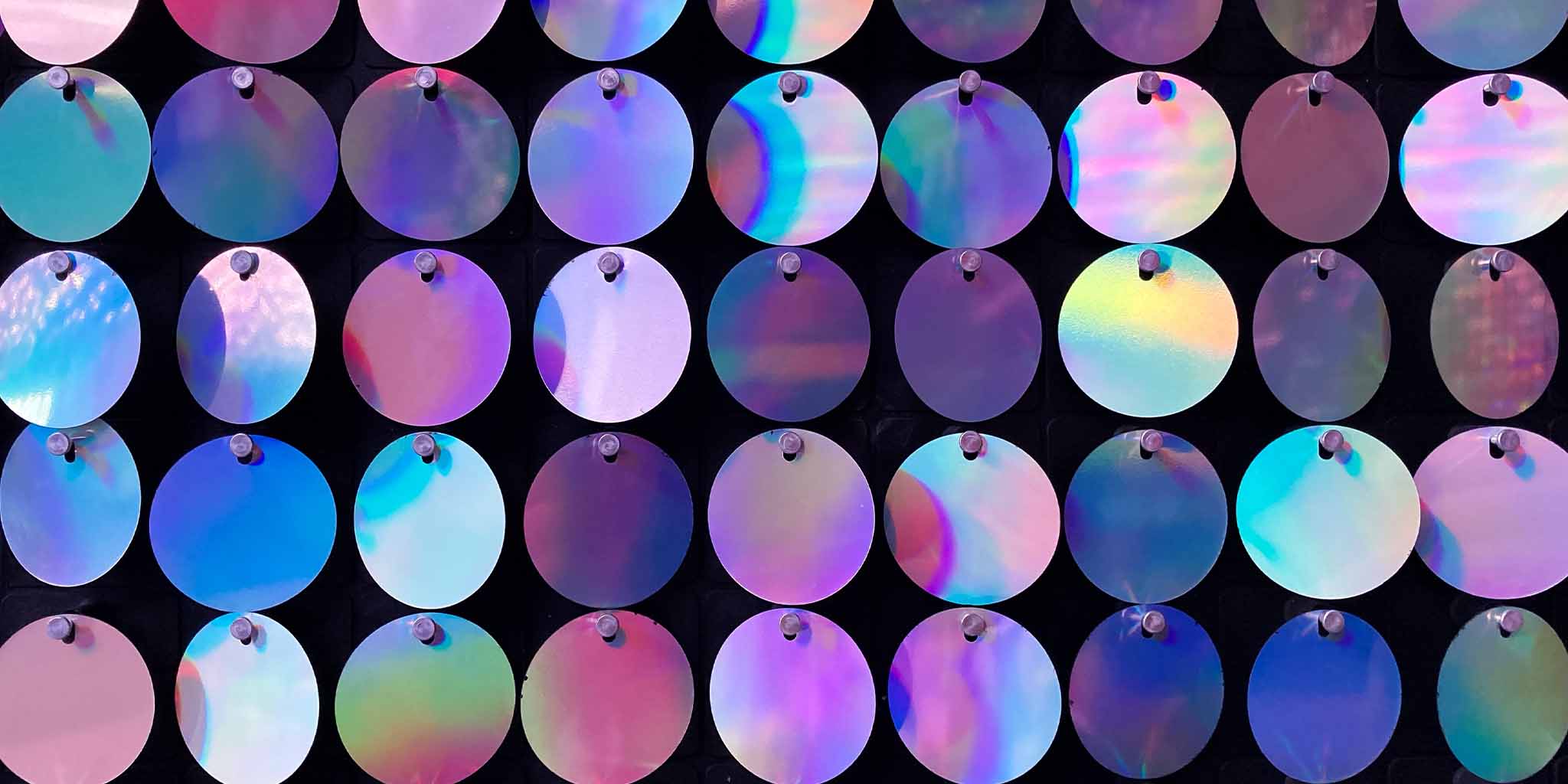 Lots of shiny, reflective purple circles linked together like glamorous chain mail